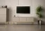 Szafka RTV Aspen I 150 cm trzydrzwiowa na metalowych nóżkach do salonu cashmere/złoty