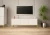 Szafka RTV Aspen I 150 cm trzydrzwiowa na metalowych nóżkach do salonu biały mat/złoty