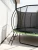 Trampolina ogrodowa 305 cm z siatką wewnętrzną i drabinką czarno-zielona