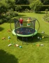 Trampolina ogrodowa 244 cm z siatką wewnętrzną i drabinką czarno-zielona