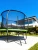 Trampolina ogrodowa 244 cm z siatką wewnętrzną i drabinką czarno-zielona